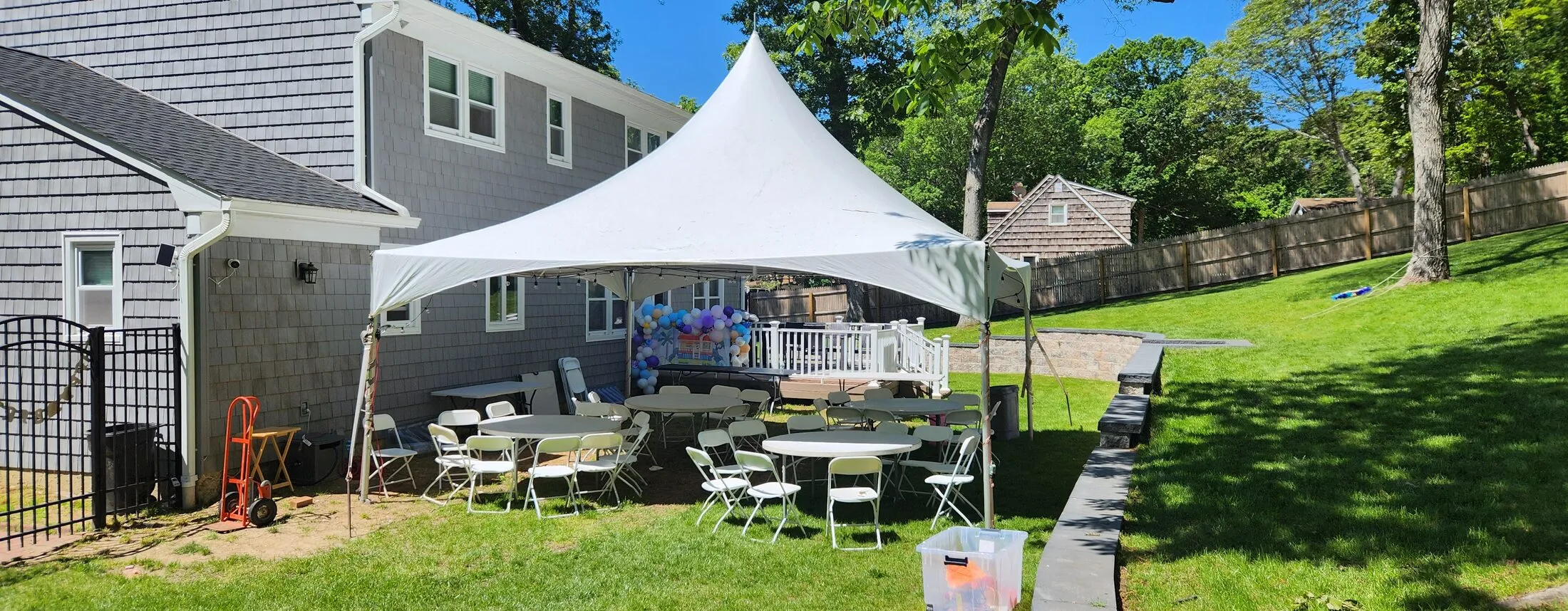 Table and chair rentals under a party tent on Long Island