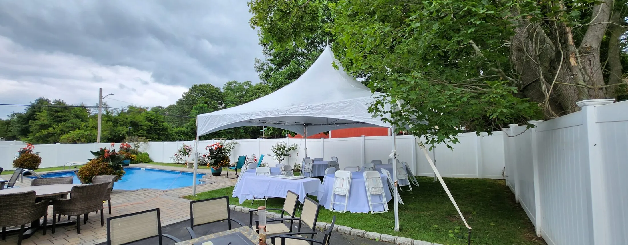 Table and chair rentals under a party tent on Long Island